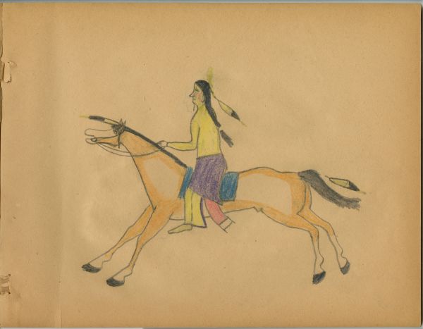 Man in yellow shirt riding tan horse